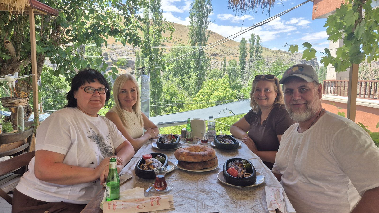Lunch on a terrace above a green valley